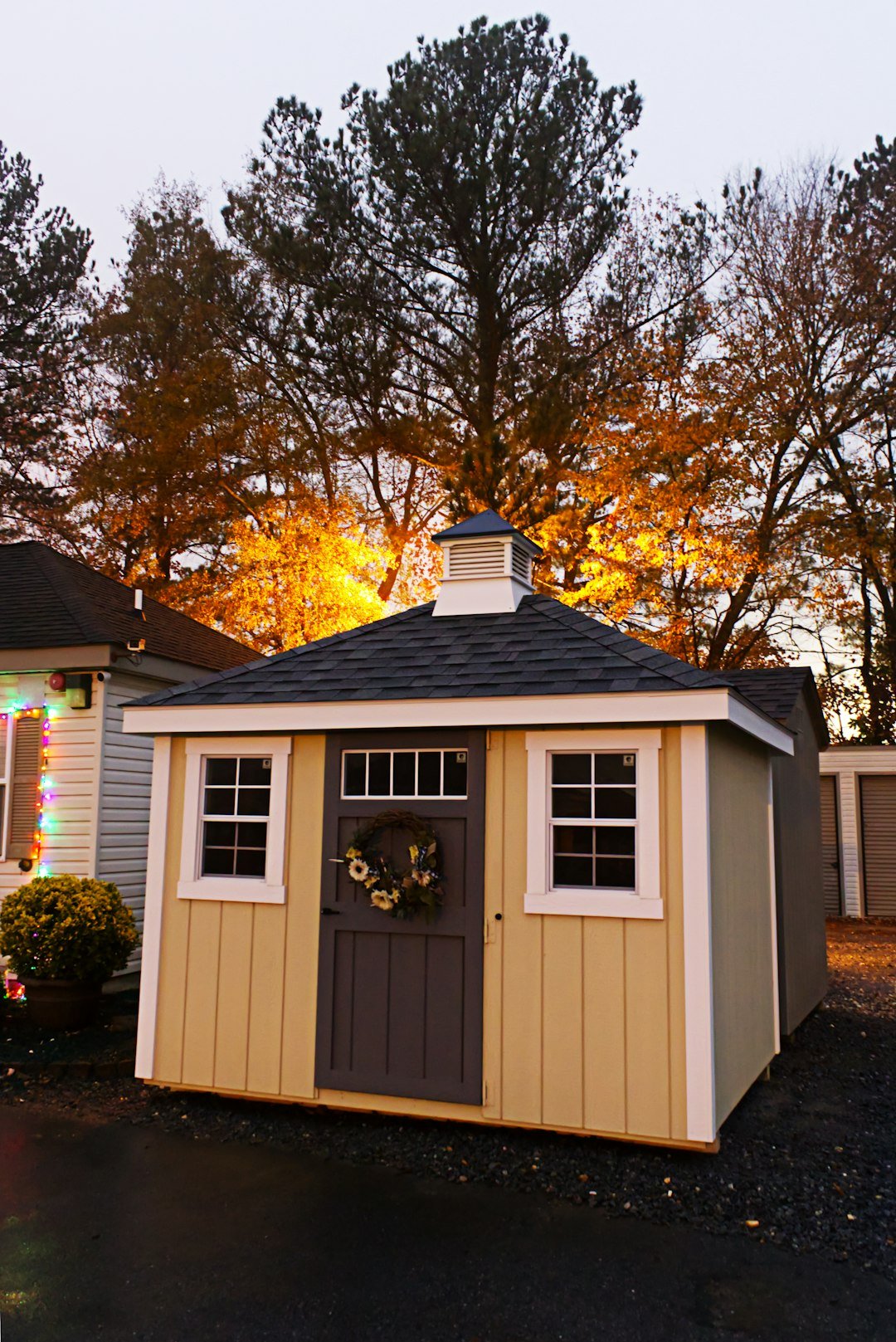 behind-the-scene-02 Shed backed by the warm glow of a street light in the fog at dusk.