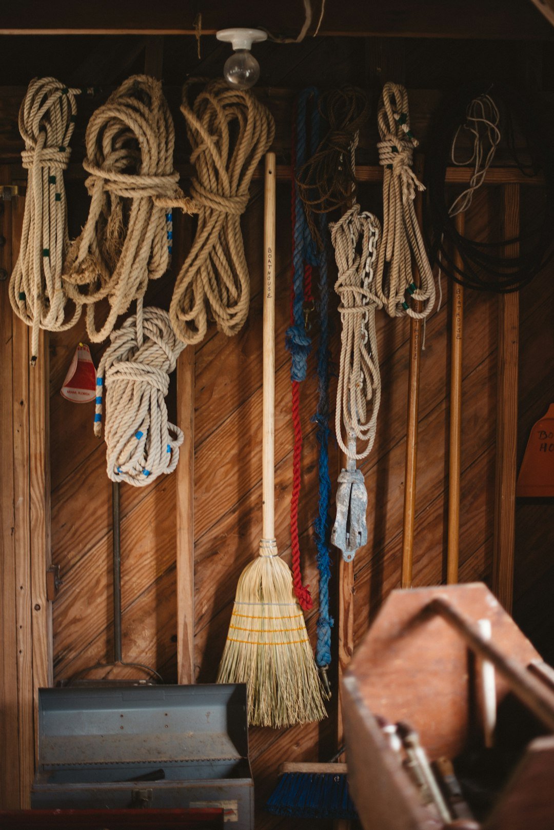 white-and-blue-rope-hanged-on-brown-wooden-wall-lrce2ne0iwu