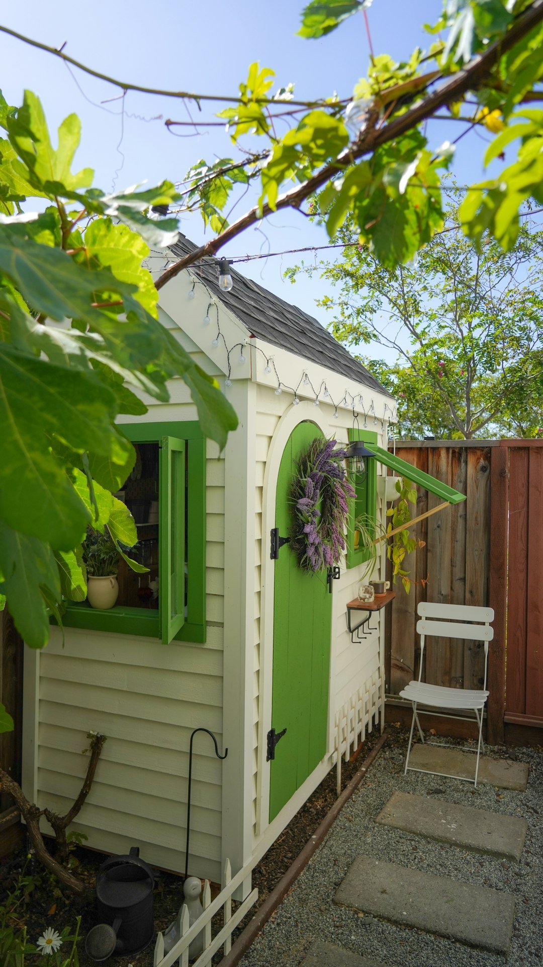 white-garden-shed-with-green-door-and-windows-3dazxlxdlcm